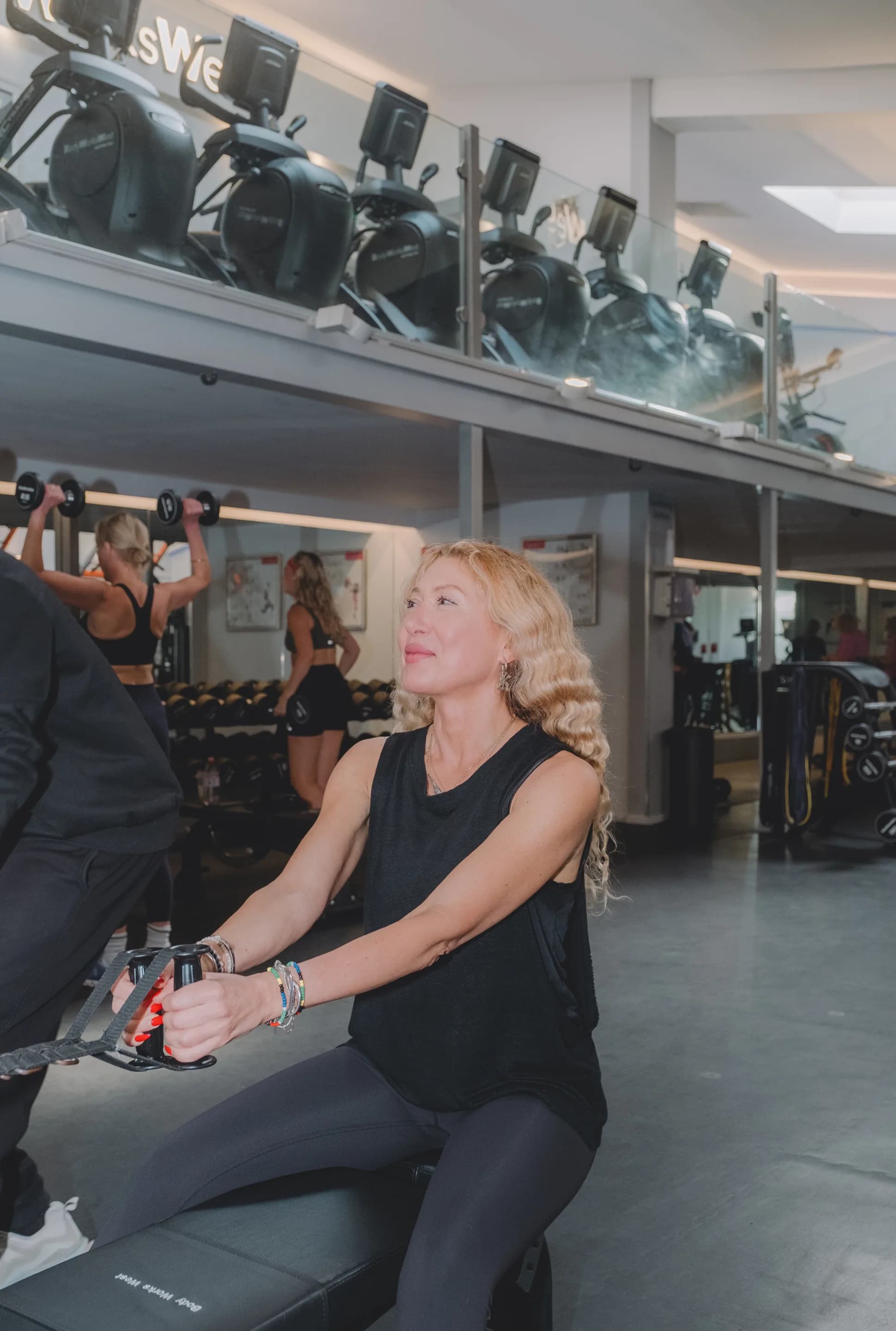 Members training on the gym floor at Body Works West