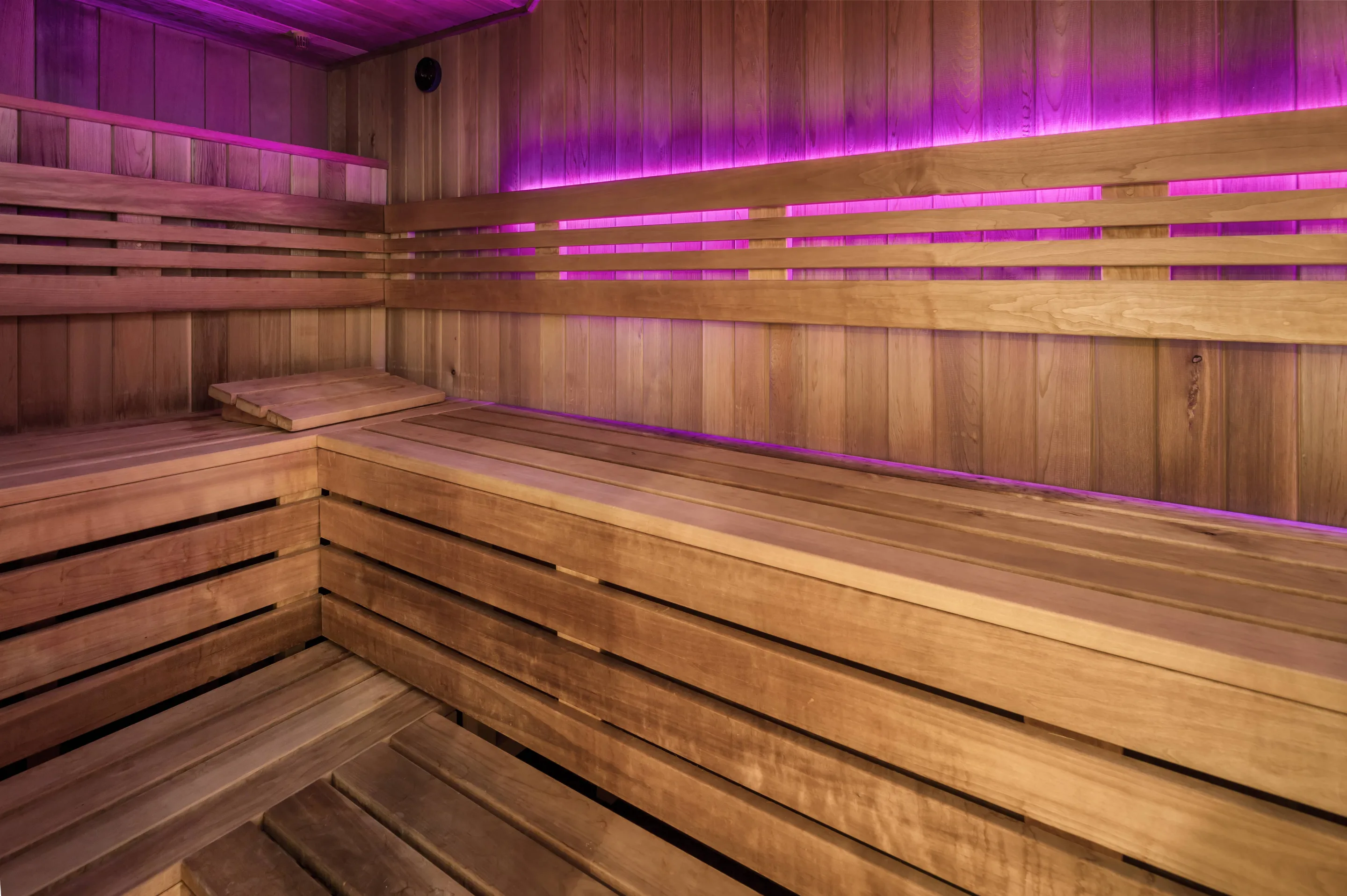 Wood-panelled sauna interior at Body Works West
